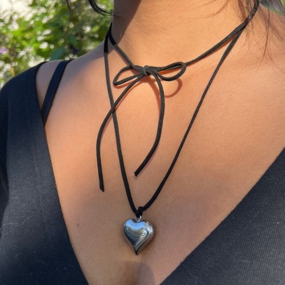 Puffed heart pendant on a long black wrap around cord necklace. - Picture 1 of 4
